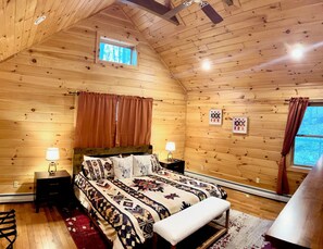 Primary bedroom with king bed and en suite.