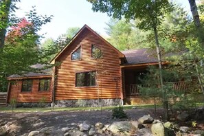 A lovely cabin in a peaceful wooded setting.