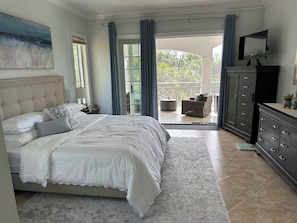 BR#1 - Primary with King size bed and french doors opening to screened in lanai
