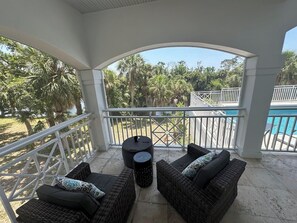 Have coffee on the screened in back lanai overlooking the refreshing pool