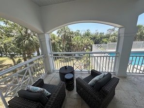 Have coffee on the screened in back lanai overlooking the refreshing pool