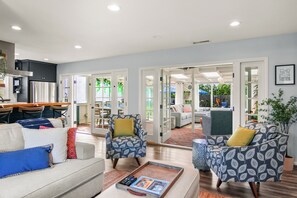 Double Santa Barbara doors and windows welcome you to the Sunroom, a guest fave!