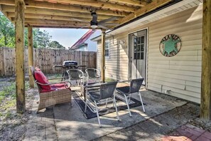 Outdoor seating area and a grill for all dining and lounging needs.