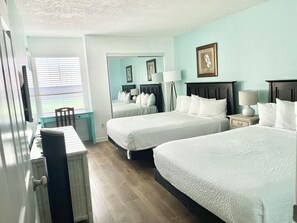 2 Queen beds in the master bedroom and work desk with chair.