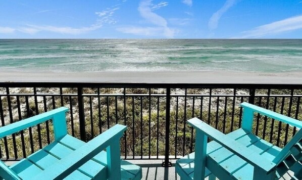 Balcony with raised polywood chairs seats 5 with 2 tables for drinks and dining