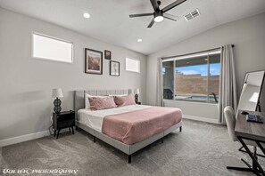Master bedroom with a dual monitor work station so you can "work" AND golf 😎