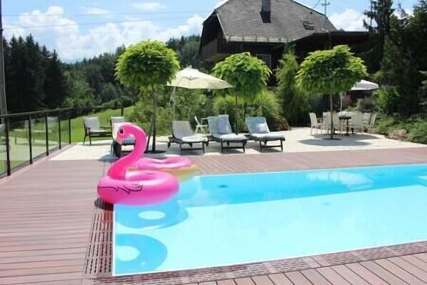 Salt water pool with plenty of lounging space