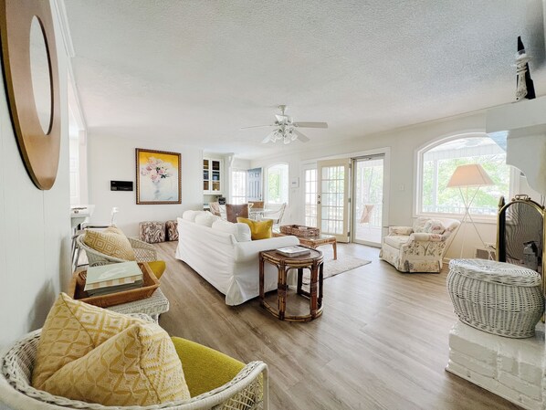 Upstairs living space with gas fireplace and lots of natural light. 