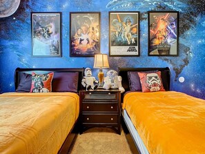 Star Wars Themed Bedroom (1 Queen + 1 Twin) with Star Wars frames beautifully displayed on the walls.
