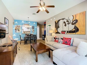 Enjoy our spacious living and dining area, showcasing fun and unique themes!