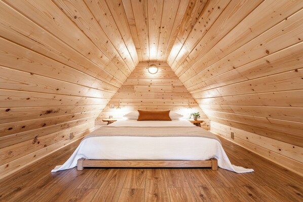 A queen-sized bed is where you will sleep in the romantic loft.