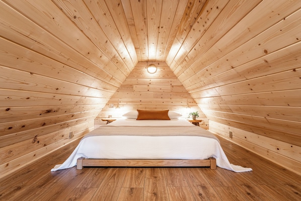 A queen-sized bed is where you will sleep in the romantic loft.