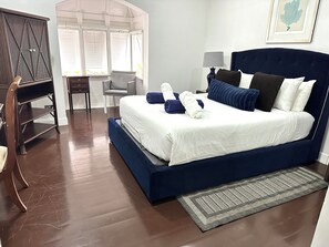 Bedroom is spacious and airy.