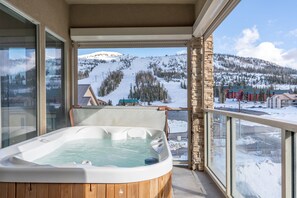 Soak in the outdoor tub while enjoying breathtaking mountain views—pure relaxation awaits! | The Juniper, Brian Head, Utah | Voyax Luxury Vacation Rentals