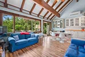 Bring the outside in with the wall of windows overlooking the backyard - 2 Bayberry Road Harwich Port Cape Cod-Cranberry Cottage-NEVR