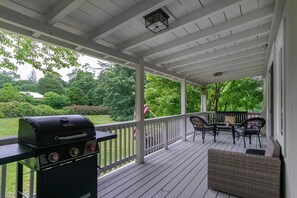 Relax and enjoy your morning coffee on the side porch with seating for up to 6.