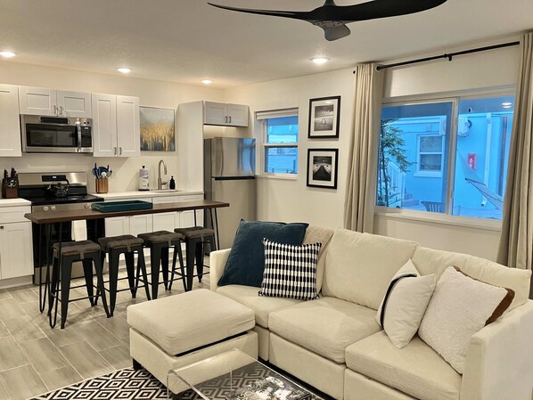 Living area and fully equipped kitchen