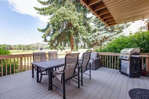 The private outdoor patio with a table and chairs for 4 guests.