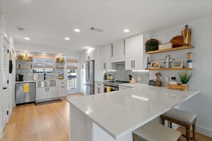 Large new kitchen with loads of storage and prep space!