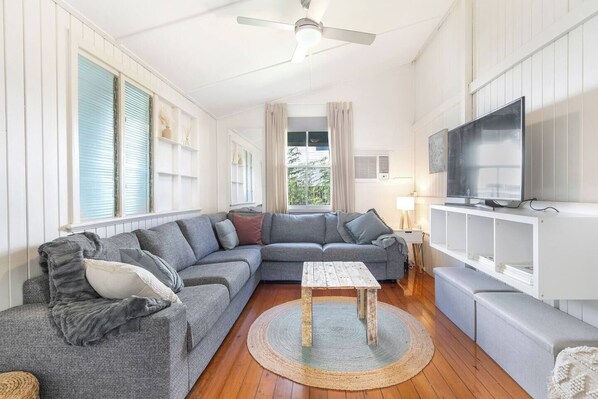 Get comfortable on the family-sized sofa in the living room with a TV for your evening entertainment.
