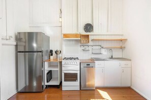 The kitchen includes everything you’ll need to prepare meals at home, with a fridge, stove, oven and dishwasher.
