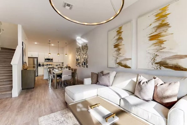 Modern comfort and stylish charm in our cozy living room.