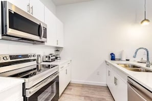 Fully equipped kitchen for culinary adventures and home-cooked delights.
