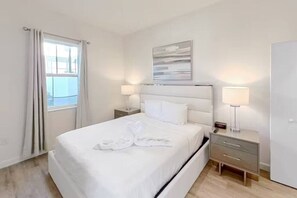 Unwind like royalty in the bedroom featuring a luxurious king-sized bed and a TV.