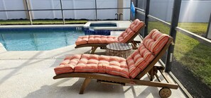 Relaxing poolside retreat, perfect for lounging and enjoying sunny days.