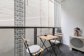A private balcony complete with a two-seater setting provides a cosy spot to sip your morning coffee or enjoy a glass of wine as the sun goes down. 
