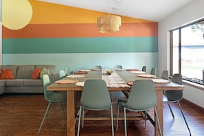 Accent wall overlooking the large dining table!
