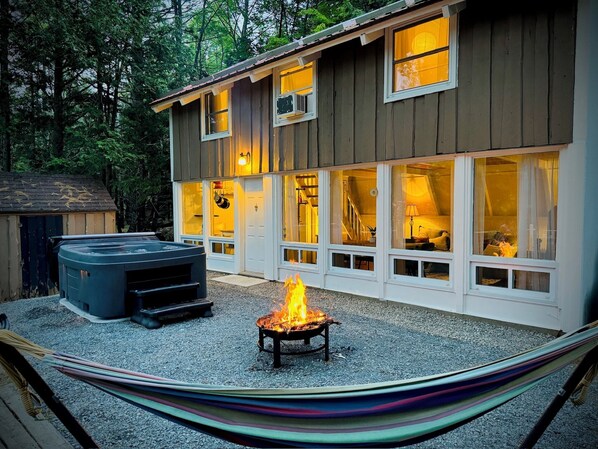 View of the outside space with fire and hot tub available year round (1)