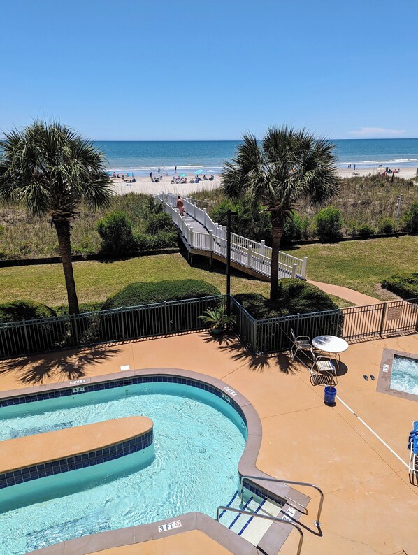 Lazy river, hot tub, pool, and private bridge to the beach.