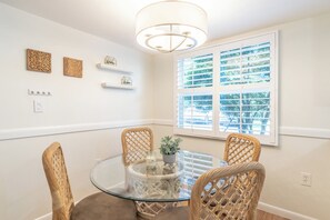 Kitchenette with glass/wicker table. Seats 4