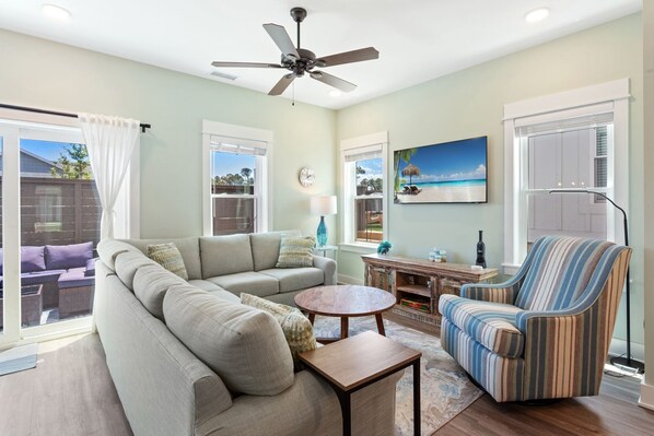 Relax in the spacious Living Area with a large Flat Screen TV at Blue Water!