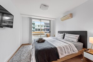 Bedroom 1 - King bed, Aircon, Smart TV, Balcony + Bathroom