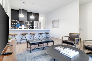 Living, dining & kitchen spaces blend seamlessly in this open-concept area.