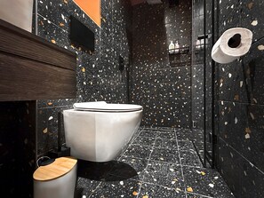 Spa-Like Experience: Indulge in a spa-like experience with a luxurious rain shower and premium fixtures.