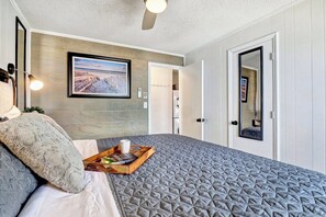 King bedroom with smart tv, reading lights, ceiling fan and it’s own climate control — everything you’ll need for a good night’s sleep on the ocean.