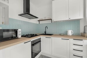 Kitchenette with a microwave.