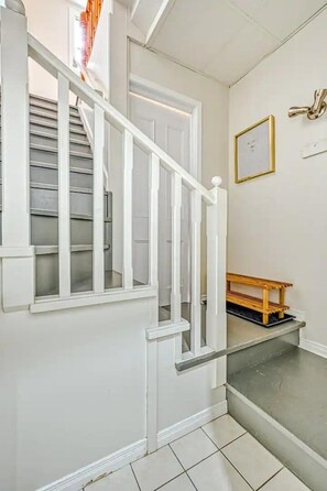 Space to hang coats and leave shoes before heading up to the suite