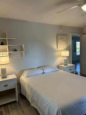 Alt view queen bedroom first floor with screened in porch accss