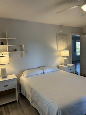 Alt view queen bedroom first floor with screened in porch accss