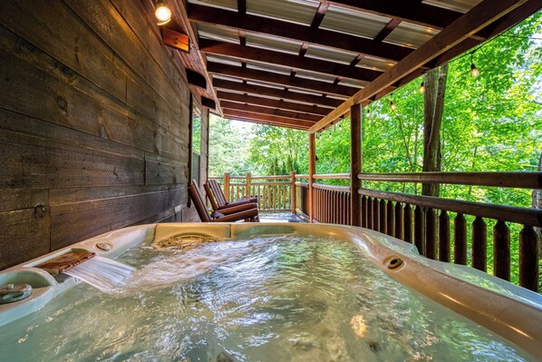 Enjoy the hot tub on the deck under the string lights!