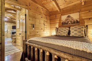 Comfortable bed with TV in bedroom