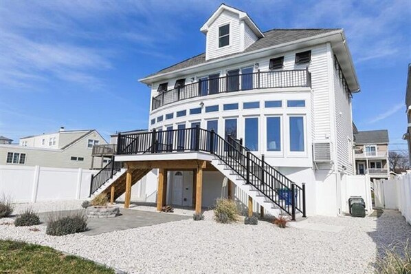 Rear of Home , Oversized deck overlooking the Golf Course and fenced in backyard