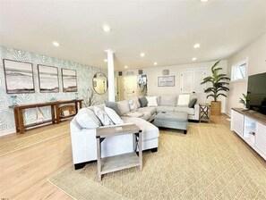 1st floor family room with oversized comfortable sectional couch, TV