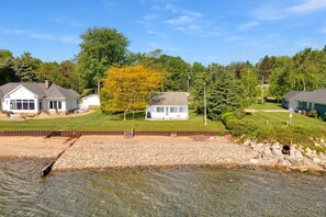 View of the home and beach, please note the beach has rocks we recommend water shoes!