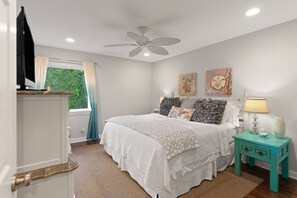 You'll sleep great in the primary bedroom's king size bed.