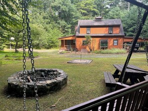 Backyard in summer, facing cabin